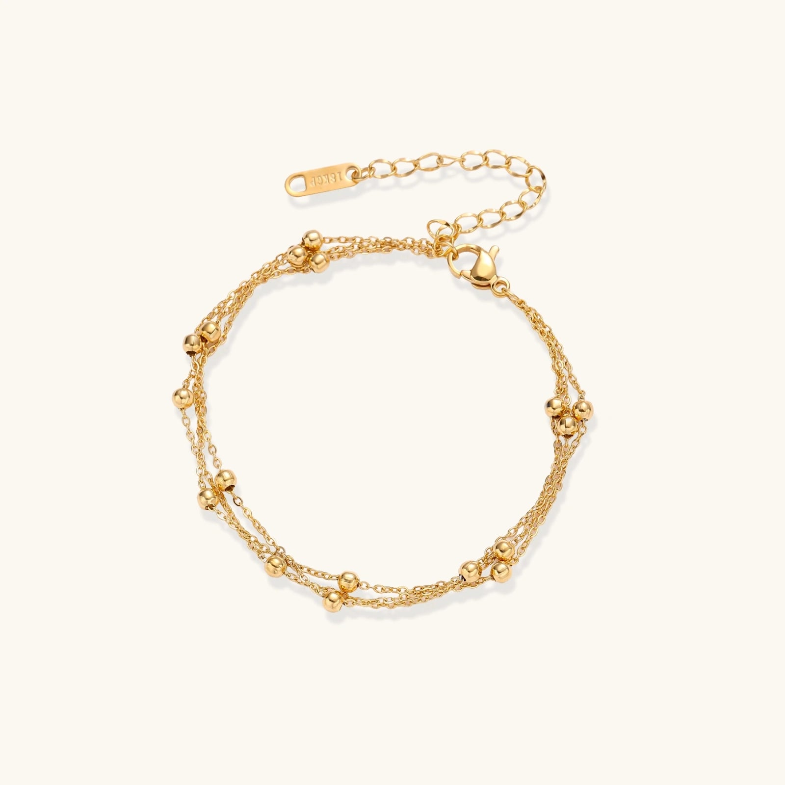 The Orbit Bracelet — Triple-Strand Gold Beaded Chain <span class="by">by Monarch & Marigold Co.</span>