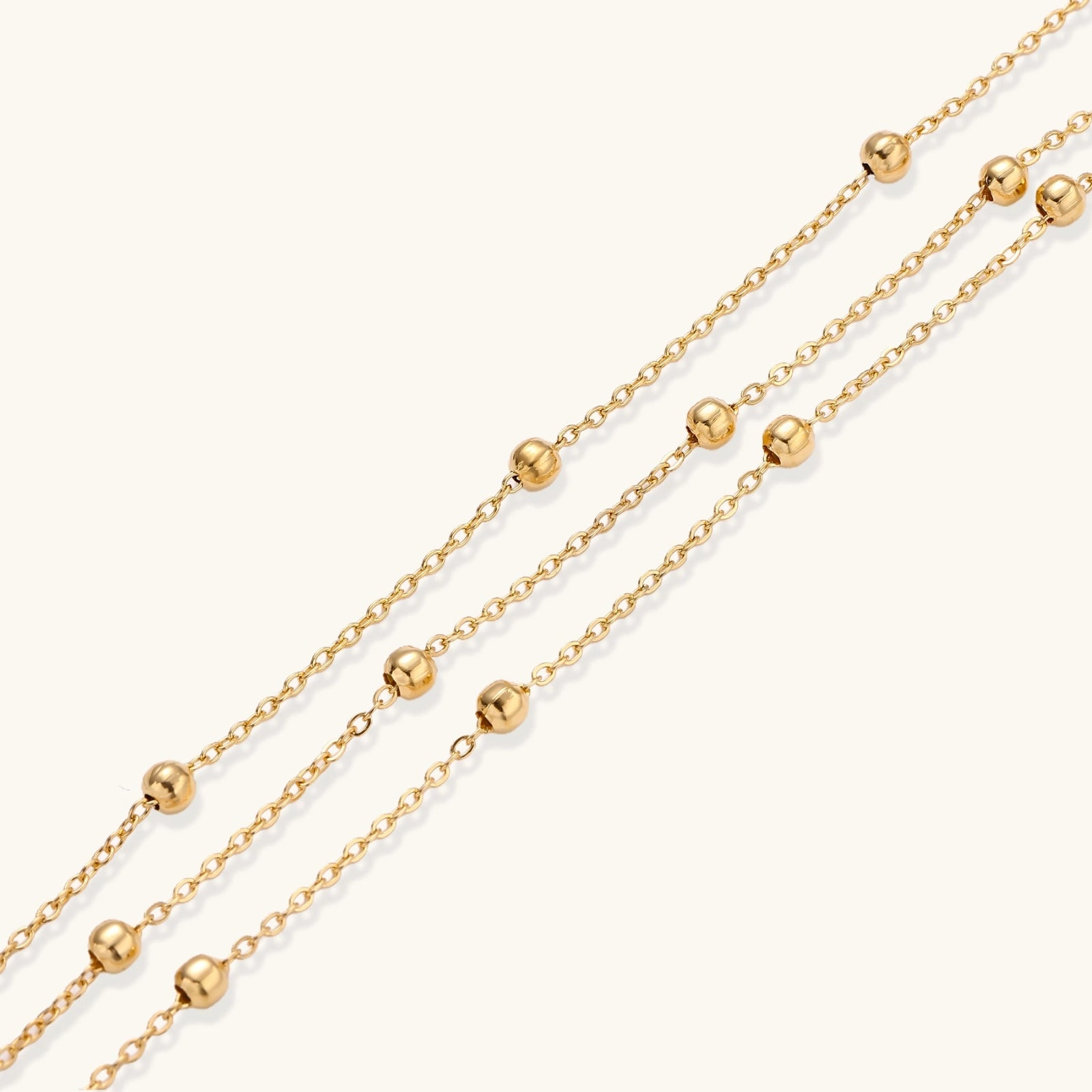 The Orbit Bracelet — Triple-Strand Gold Beaded Chain <span class="by">by Monarch & Marigold Co.</span>